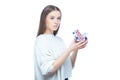 Studio shot of a young female holding in her hands a small shopping cart full of pills, tablets and medicine, isolated Royalty Free Stock Photo