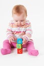 Studio Shot Of Young Girl Playing With Alphabet Blocks Royalty Free Stock Photo