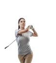 Going for distance and accuracy. Studio shot of a young golfer practicing her swing isolated on white. Royalty Free Stock Photo