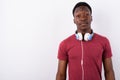 Young handsome African man wearing headphones against white back Royalty Free Stock Photo