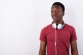 Young handsome African man wearing headphones against white back Royalty Free Stock Photo