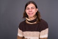 Young androgynous man with long hair ready for winter Royalty Free Stock Photo