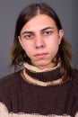 Young androgynous man with long hair ready for winter Royalty Free Stock Photo