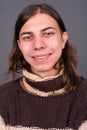 Young androgynous man with long hair ready for winter Royalty Free Stock Photo