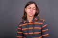 Young handsome androgynous man with long hair Royalty Free Stock Photo