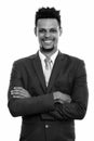 Studio shot of young happy African businessman smiling with arms crossed Royalty Free Stock Photo