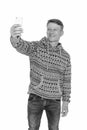 Studio shot of young happy Caucasian man taking selfie isolated against white background Royalty Free Stock Photo