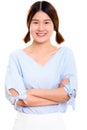 Studio shot of young happy Asian woman smiling with arms crossed Royalty Free Stock Photo