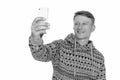 Studio shot of young happy Caucasian man taking selfie isolated against white background Royalty Free Stock Photo
