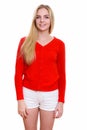 Studio shot of young happy teenage girl smiling Royalty Free Stock Photo