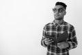 Young Indian man wearing checkered shirt against white background Royalty Free Stock Photo