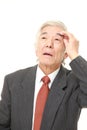 Senior Japanese businessman has lost his memory Royalty Free Stock Photo