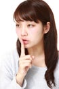 Young Japanese woman whith silence gestures