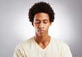 Inhale confidence, exhale doubt. Studio shot of a young man posing against a gray background. Royalty Free Stock Photo