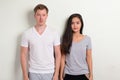 Studio shot of young multi-ethnic couple standing together Royalty Free Stock Photo