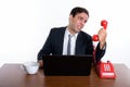 Studio shot of young stressed Persian businessman looking at old Royalty Free Stock Photo