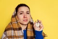 Studio shot young woman flu and cold, feeling sick posing isolated on yellow studio background. Royalty Free Stock Photo