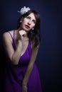 Studio shot of young woman looking up the light