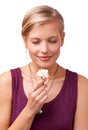 All natural aromatherapy. Studio shot of a young woman smelling a flower isolated on white. Royalty Free Stock Photo