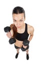 Getting stronger with every lift. Studio shot of a young woman working out with dumbbells against a white background. Royalty Free Stock Photo