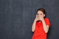 Portrait of shocked scared young woman covering mouth with hands Royalty Free Stock Photo