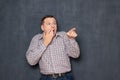 Shot of terrified shocked man pointing at something awful Royalty Free Stock Photo