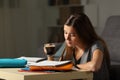 Studious student studying holding a coffee cup Royalty Free Stock Photo