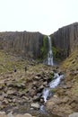 Studlafoss, Iceland - August 28 2025: people enjoy the Waterfall in the canyon Studlagil Royalty Free Stock Photo
