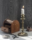 Candelabra with candle, inlaid jewelry box, women`s mirror. Royalty Free Stock Photo