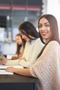 We study best as a team. Portrait of a group of happy students having a study session in a cafe. Royalty Free Stock Photo