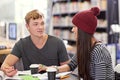 Study buddies. two college students studying together at the library. Royalty Free Stock Photo