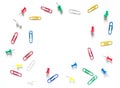 Study concept background. Colorful office stationery: drawing pins and clips on white background with copy space Royalty Free Stock Photo