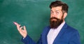 Study concept. Portrait of a funny teacher or professor near blackboard. Thinking serious mature teacher. Mature Royalty Free Stock Photo