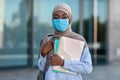 Study During Coronavirus. African Muslim Female Student In Medical Mask Posing Outdoors Royalty Free Stock Photo