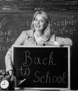 Study and education. Modern school. Knowledge day. teacher with alarm clock at blackboard. Time. Back to school Royalty Free Stock Photo