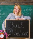 Study and education. Modern school. Knowledge day. teacher with alarm clock at blackboard. Time. Back to school Royalty Free Stock Photo