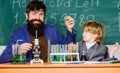 Study in educational activity through experience. I love study in school. Teacher and pupil boy in chemical laboratory Royalty Free Stock Photo