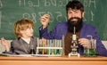 Study in educational activity through experience. I love study in school. Teacher and pupil boy in chemical laboratory Royalty Free Stock Photo