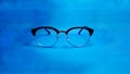 Study glasses on blue background