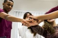 Study group classmates joining hands together Royalty Free Stock Photo