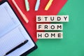 `Study from home` on wood block concept with red and green background. Royalty Free Stock Photo