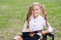 Study language. Cute smiling small child hold book. Adorable little girl school student. School education concept. Cute Royalty Free Stock Photo