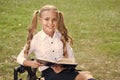 Study language. Cute smiling small child hold book. Adorable little girl school student. School education concept. Cute Royalty Free Stock Photo