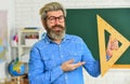 Study mathematics. Mature bearded teacher in glasses. Education concept. Talented pedagogue. Private lesson. Back to Royalty Free Stock Photo