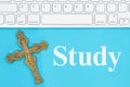 Study message with gray keyboard with a religious cross Royalty Free Stock Photo