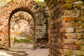 Study of the old fortress of the catacombs brick ruined arch of a series of broken portal dangerous walk Royalty Free Stock Photo