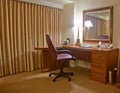 Study room with armchair lamp and mirror