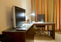 Study room with writing desk and tv set Royalty Free Stock Photo