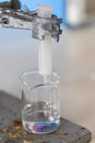 Separating by filtration and evaporation condensation the component substances from liquid mixture in Lab. Royalty Free Stock Photo