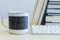 Study time words on mug with keyboard and books Royalty Free Stock Photo